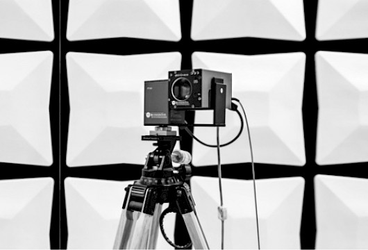 EMC video camera on a wooden tripod