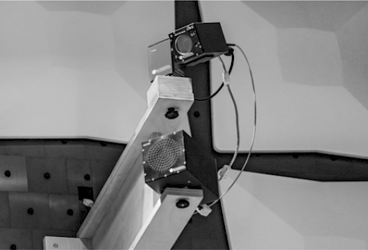 EMC video camera and pressure chamber loudspeaker on a wall bracket